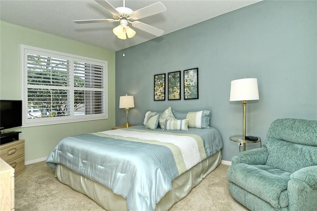 bedroom featuring ceiling fan, carpet, and baseboards