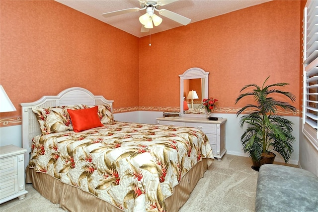 bedroom with ceiling fan and light colored carpet