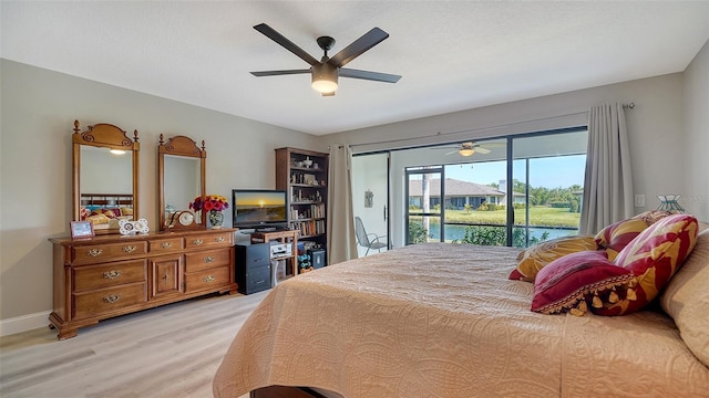 bedroom with light wood finished floors, baseboards, a ceiling fan, access to outside, and a textured ceiling