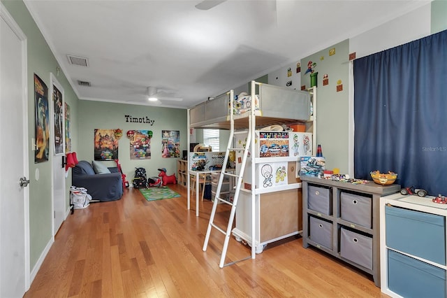 bedroom featuring light wood-style floors and visible vents