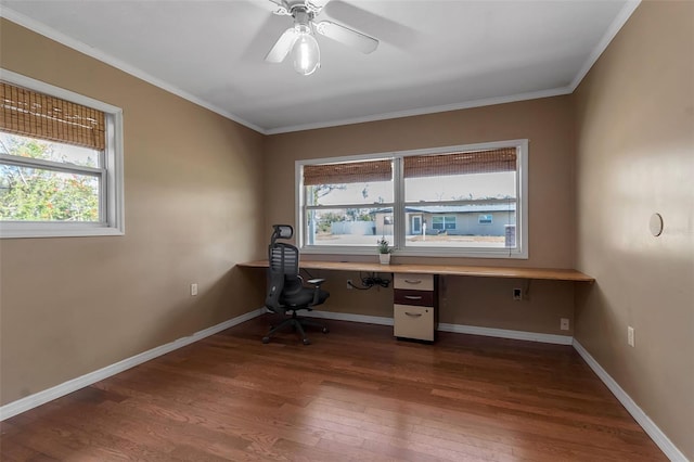 unfurnished office with baseboards, built in desk, and dark wood-type flooring