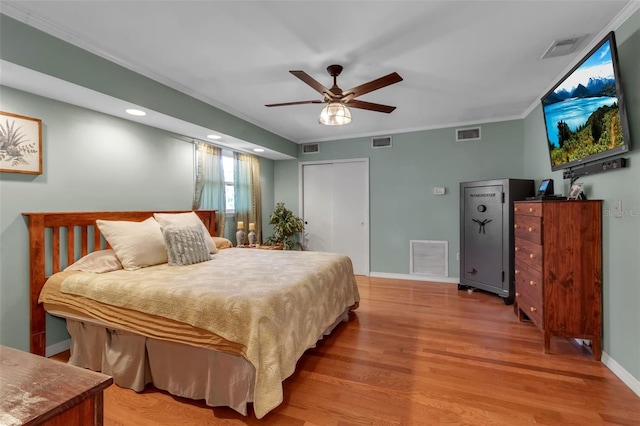 bedroom with visible vents and light wood finished floors