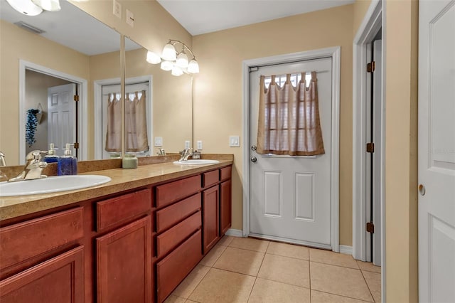 full bath featuring tile patterned flooring, visible vents, a sink, and double vanity