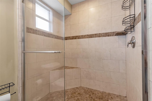 bathroom with tiled shower