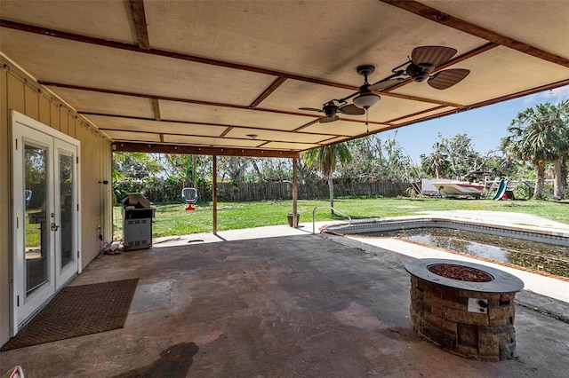 view of patio featuring french doors, a fenced backyard, ceiling fan, and area for grilling