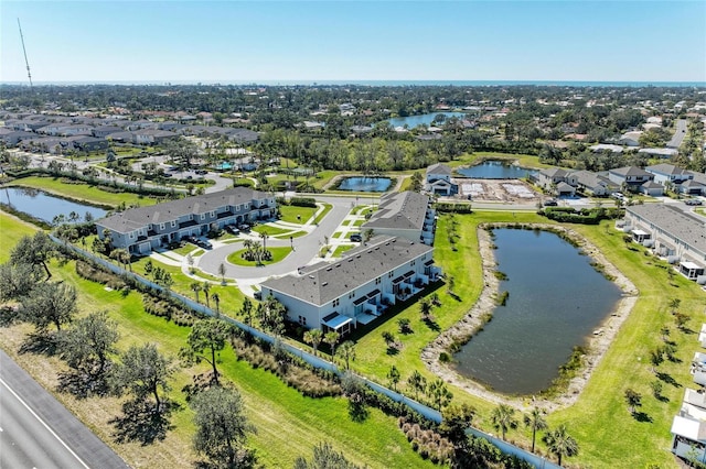 bird's eye view with a water view and a residential view