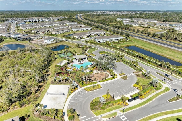 aerial view with a water view and a residential view