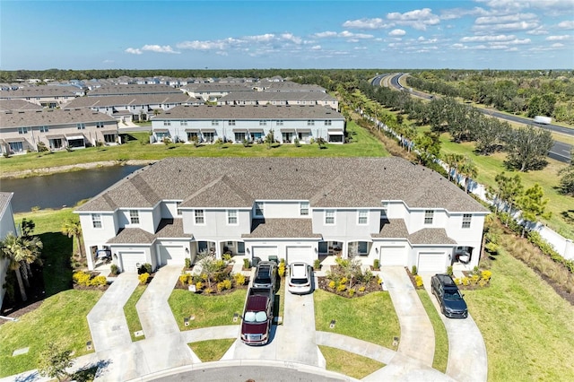 aerial view featuring a water view and a residential view