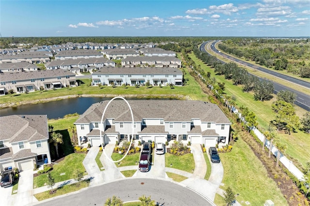 aerial view featuring a water view and a residential view