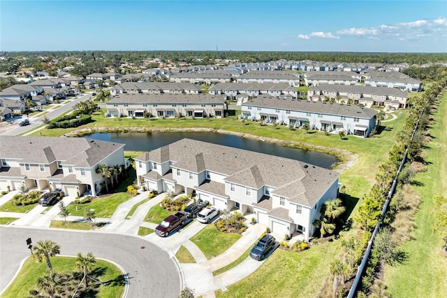 birds eye view of property with a residential view and a water view