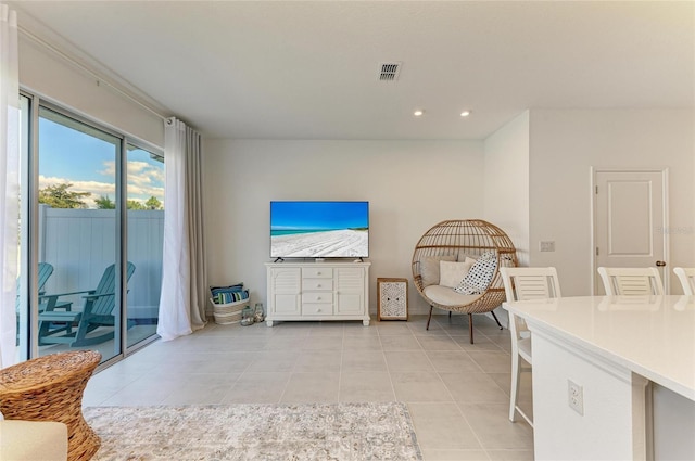 sitting room with light tile patterned floors, visible vents, and recessed lighting