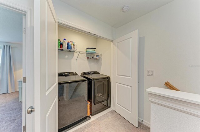 laundry area featuring laundry area and washer and clothes dryer