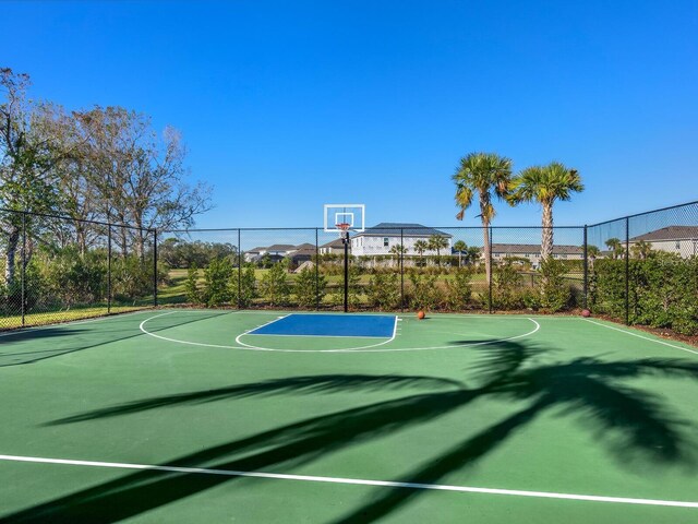 view of sport court with community basketball court and fence