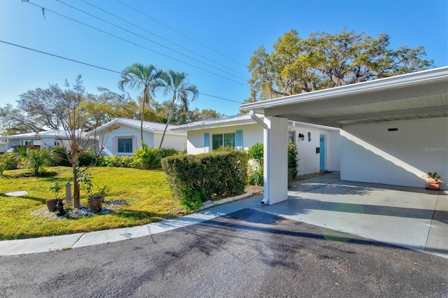 view of side of home with a yard and stucco siding