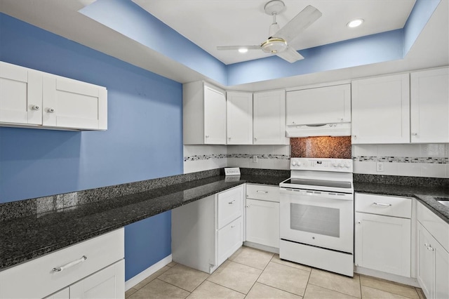 kitchen with light tile patterned floors, white range with electric stovetop, under cabinet range hood, white cabinetry, and backsplash