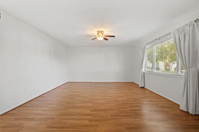 unfurnished room featuring light wood-style floors and ceiling fan