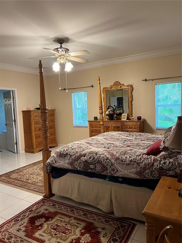 bedroom with a ceiling fan, crown molding, and light tile patterned floors