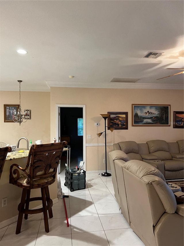 living room with light tile patterned floors, ornamental molding, and visible vents