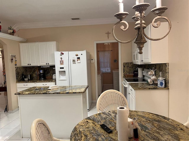 kitchen featuring white appliances, light tile patterned floors, ornamental molding, and white cabinets