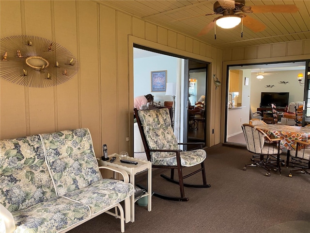 interior space with wood ceiling and ceiling fan