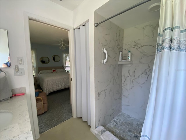 ensuite bathroom featuring a ceiling fan, a marble finish shower, and ensuite bath