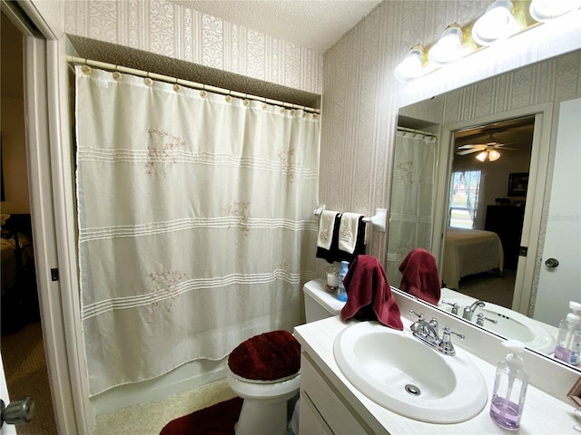 full bath featuring a textured ceiling, toilet, vanity, shower / bath combo, and wallpapered walls