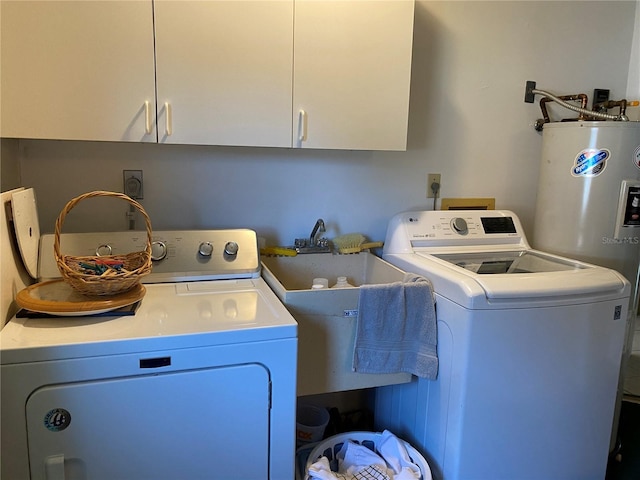 laundry area with cabinet space, a sink, and separate washer and dryer