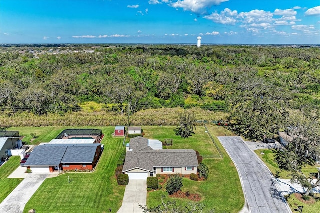 drone / aerial view with a view of trees