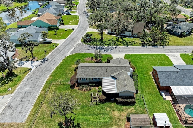 bird's eye view featuring a water view and a residential view