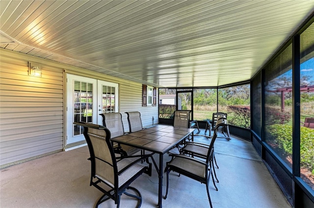 sunroom / solarium featuring french doors and a wealth of natural light