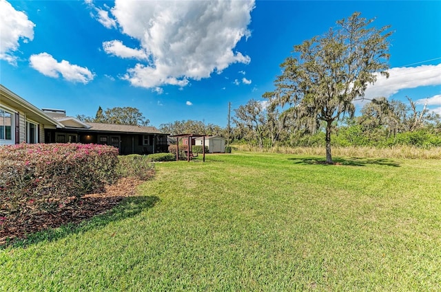 view of yard with a storage unit and an outdoor structure