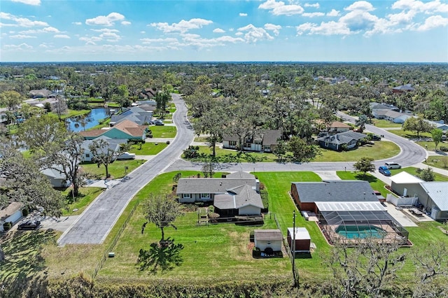 drone / aerial view featuring a water view and a residential view