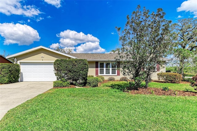 ranch-style house with an attached garage, driveway, and a front lawn