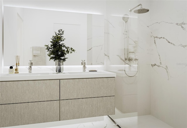 bathroom with double vanity, marble finish floor, and a marble finish shower