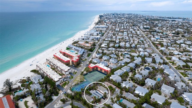 bird's eye view featuring a view of the beach and a water view