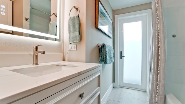 bathroom with vanity and a shower with shower curtain