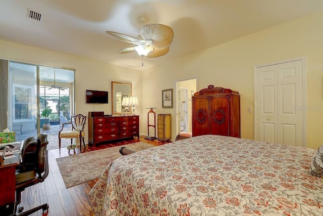 7762 US Open Loop, Lakewood Ranch, FL 34202 - bedroom featuring access to exterior, wood finished floors, and ceiling fan