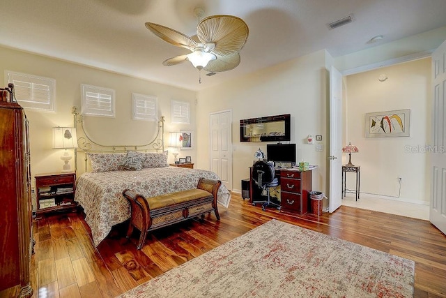 7762 US Open Loop, Lakewood Ranch, FL 34202 - bedroom with an office area, wood finished floors, ceiling fan, and baseboards