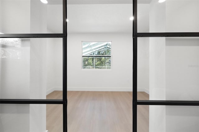 details featuring wood finished floors and baseboards