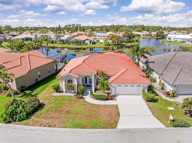 bird's eye view featuring a water view and a residential view