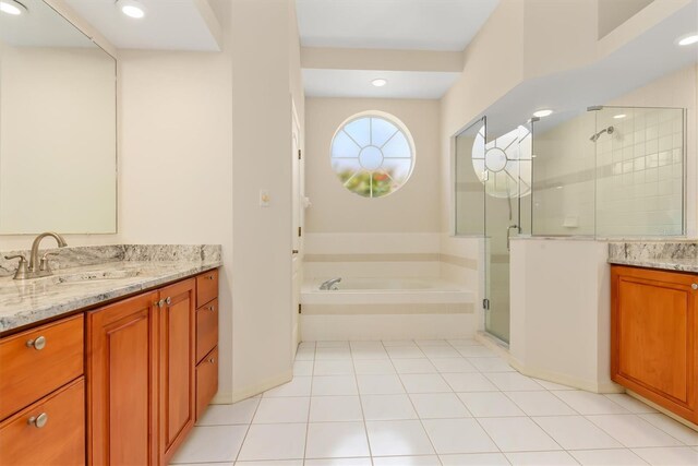 4173 Hearthstone Dr, Sarasota, FL 34238 - bathroom with tile patterned floors, a bath, vanity, and a stall shower