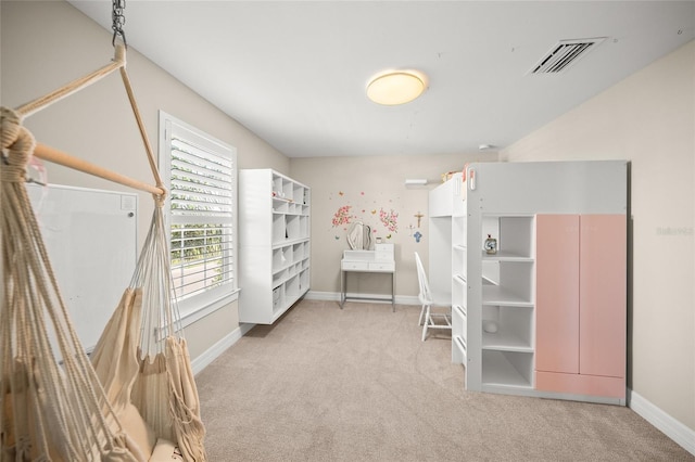 unfurnished bedroom featuring baseboards, visible vents, and light colored carpet