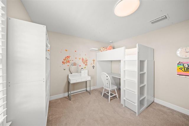 bedroom with carpet floors, visible vents, and baseboards