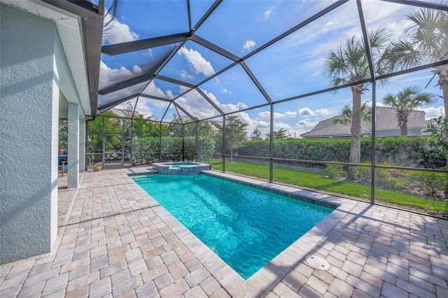 view of pool with glass enclosure, a patio area, and a pool with connected hot tub