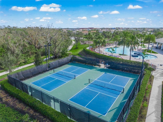 view of sport court with fence