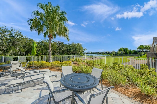 view of patio with fence and outdoor dining space