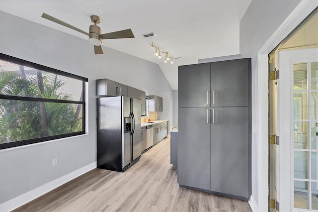 kitchen featuring light wood-type flooring, visible vents, modern cabinets, and appliances with stainless steel finishes