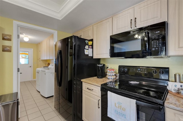 kitchen with light tile patterned floors, washing machine and dryer, light stone countertops, black appliances, and crown molding