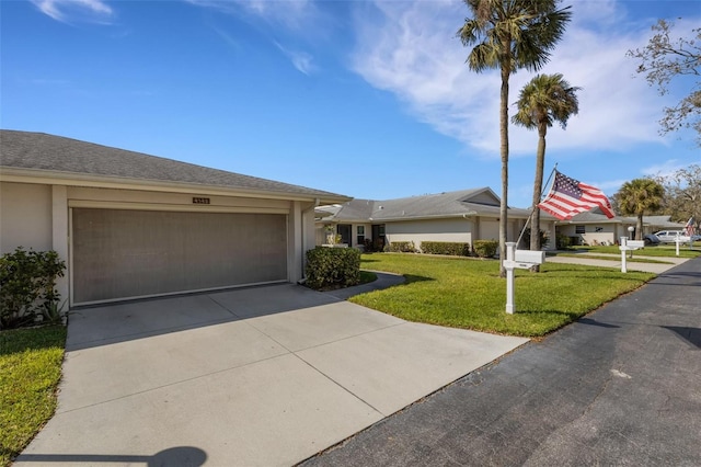 ranch-style home featuring a garage, concrete driveway, a front lawn, and stucco siding