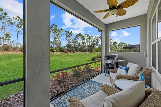 sunroom with a ceiling fan